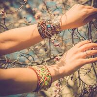 Fashion shot of a beautiful boho style girl on nature background. Boho, hippie. photo