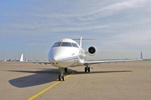 business plane parked at the airport photo