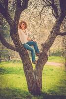 Fashion shot of a beautiful boho style girl on nature background. Boho, hippie. photo