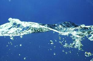 Fresh water with waves and bubbles photo