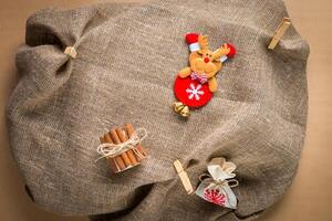 Christmas decoration on natural sackcloth background photo
