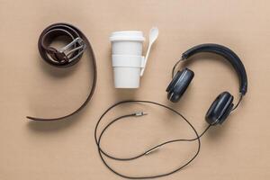 Cup, belt, earphones photo