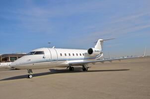 business plane parked at the airport photo