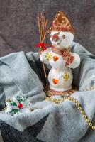 Happy snowman on a colored background photo