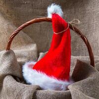 Santa cap on natural sackcloth background photo