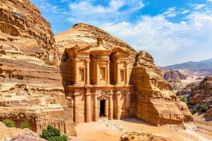 a large building is carved into the side of a mountain photo