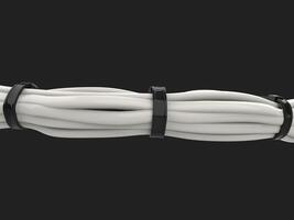 Bucnh of white cables tightly tied together with zipties photo