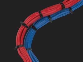 Red and blue cables bunched together and held together with zipties photo