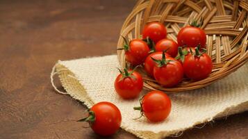 Fresh Cherry Tomatoes fall from plate brown background with higle angle view and dark mood photography, copy space photo