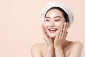 Beautiful asian women washing face with copy space on solid pastel background.Beauty,skin care and spa concept, Asian woman portrait.Created with Generative AI technology. photo