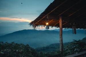 Lanterns hanging under the roof at dusk,lantern hangs below the roof. photo