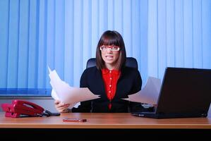 .angry businesswoman holding documents photo