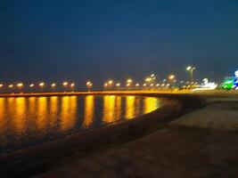 Beautiful morning view of Al Qunfudhah Beach, Saudi Arabia. The lights on the beach are creating a beautiful scene in the morning. photo