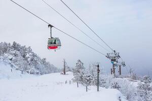 Cable car atop the snow-capped Deogyusan mountains at deogyusan national park near Muju, South Korea. photo