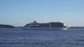 Silver Muse cruise ship from Silversea Cruises ultra-luxury cruise line past the famous Stanley Park in Vancouver for a seven-day Alaska cruise vacation. August 22, 2019. Vancouver, BC, Canada. video