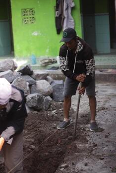 Magelang,Indonesia.- 10 10 2023-Indonesian construction workers are working on a project. Working manually. photo