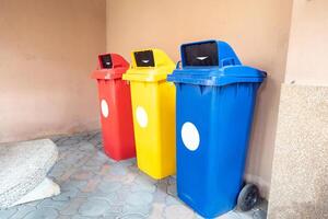 Color-segregated bins for proper waste separation photo