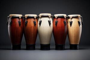 AI Generated Five conga drums in row isolated on dark background. Traditional percussion musical instrument of AfroCuban and Latin American culture. Suitable for musicrelated projects and cultural designs photo