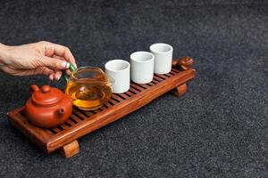 Chinese tea ceremony Asian wooden table board chaban top view copy space morning energy. photo