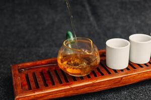 Chinese tea ceremony Asian wooden table board chaban top view copy space morning energy. photo