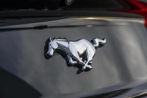 02.29.2024 Gazeveren Cyprus - Ford Mustang emblem on a black trunk lid 3 photo