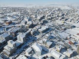 Top view from a drone of a snowy city. Sarikaya,Yozgat,Turkey photo