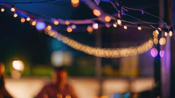 DDefocused restaurant with outdoor string lights on a blurred background photo