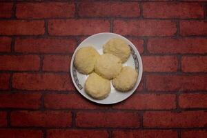 Irani Bhog sweet served in plate isolated on background top view of bangladeshi dessert food photo