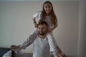 father plays with his daughter photo