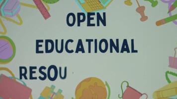 Open Educational Resources inscription on background with school supplies appearing one by one. Teaching, learning and research materials accessible for use. Education concept. Blurred video