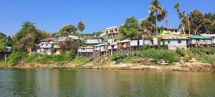 Housing on silts of Rural settlements of tribal fishing village of Rangamati Bangladesh photo