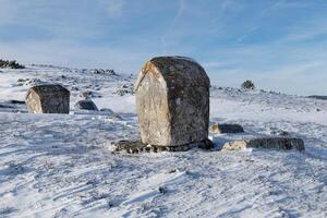 Stecci Medieval Tombstones Graveyards in Ravanjska Vrata in Kupres, Bosnia and Herzegovina. Unesco site. The tombstones feature a wide range of decorative motifs and inscriptions. photo