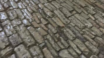 shiny worn stone slippery floor in the huge castle of gerakaster tiles worn off over time by many tourists passing on excursions video