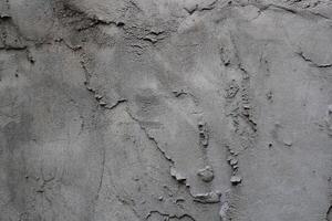 desigual cemento y arena pared textura fondo, sucio cemento pared superficie, rústico arena pared foto