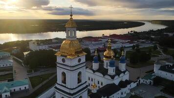 Aerial. the bell tower of the Tobolsk Kremlin on the high bank of the river video