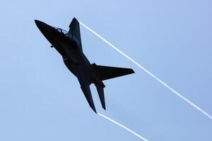 Polish Air Force Leonardo M-346 Master Bielik trainer jet plane flying. Aviation and military aircraft. photo