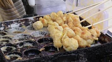 Making cilor, made from tapioca flour with macaroni and egg. Cilor is an Indonesian street food that is currently popular, especially among school children. video