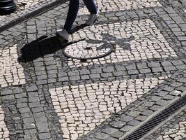 mosaic sidewalk pavement in Aveiro pictoresque village street view, The Venice Of Portugal photo
