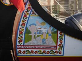 Aveiro Moliceiro boat gondola detail Traditional boats on the canal, Portugal. photo