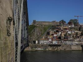 Medieval walls and cableway of Porto old town street view building, portugal view from luis bridge photo