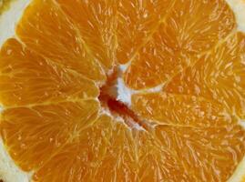 Texture of juicy wet pulp of a cut orange macro shot square stock photo