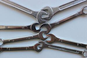 Combination Wrenches of different sizes inserted into each other with open ends photo