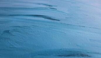 Abstract Pattern Of Variety Strokes Of Blue Paint On Fabric Surface Closeup Angle View photo
