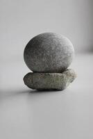 Equilibrium Concept Image. Smooth Round Stone On Another Porous Stone photo