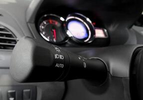 Switch of turn and light of headlights in car interior photo