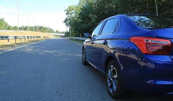 Vehicle stay at the highway exit at the sunny day photo