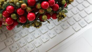 Bunch Of Plastic Berries And Fabric Leaves Over Blurred Keyboard Buttons With Latin And Cyrillic Characters photo