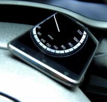 Speedometer reflections on the glass surface of mobile phone in vehicle photo