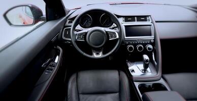 Alcantara, stitched leather and chrome upholstery in vehicle interior. Top view stock photo