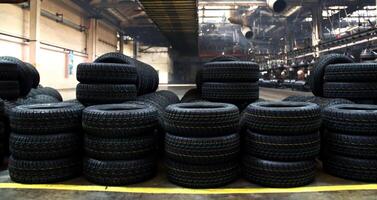 Stacking vehicle tires on the plant floor after production on rubber manufacture photo